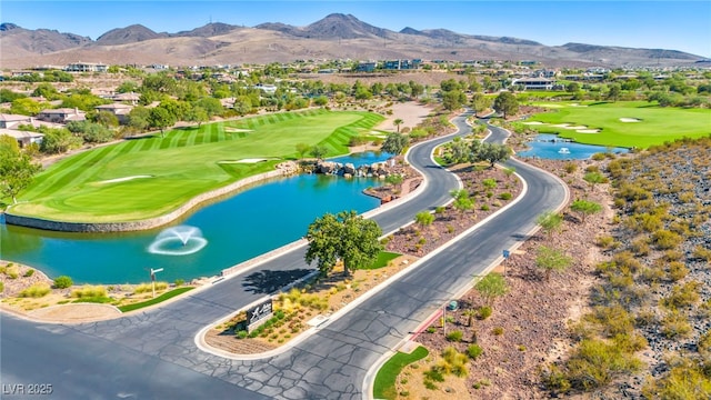 birds eye view of property featuring a water and mountain view