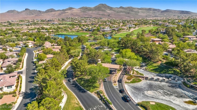 bird's eye view with a water and mountain view