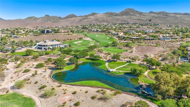 birds eye view of property with a water and mountain view