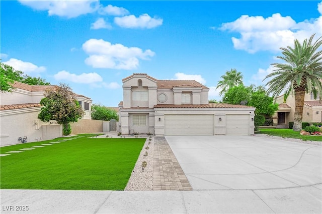 view of front of home with a garage and a front lawn