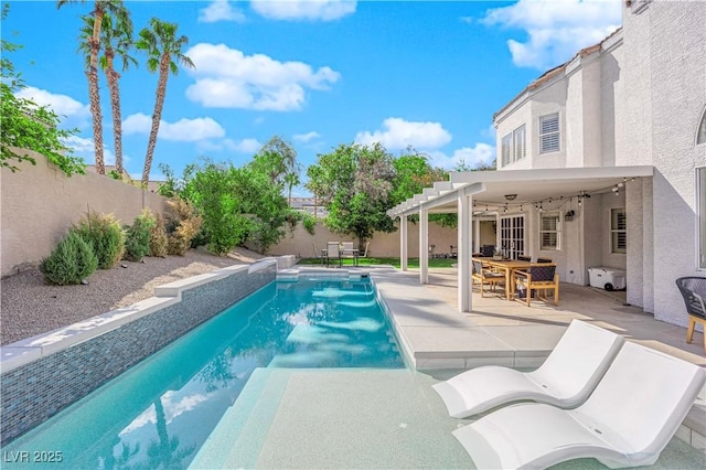 view of swimming pool with ceiling fan and a patio