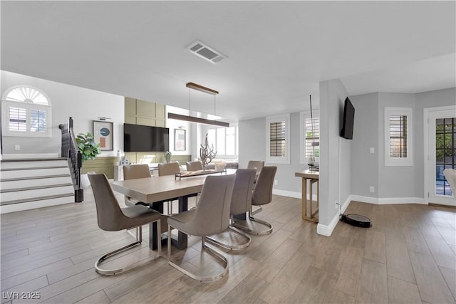 dining area with light hardwood / wood-style flooring