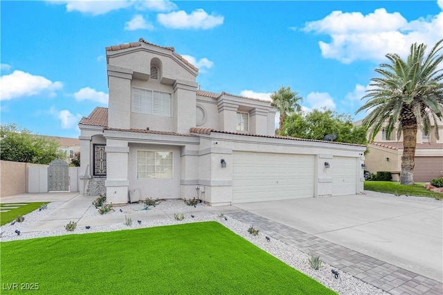 mediterranean / spanish-style house featuring a garage and a front yard