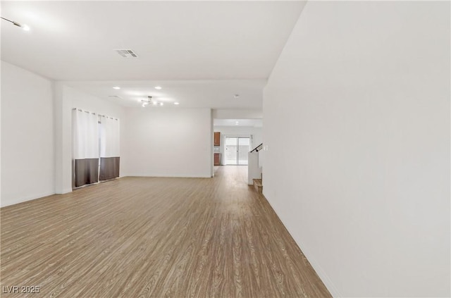 unfurnished room with hardwood / wood-style flooring