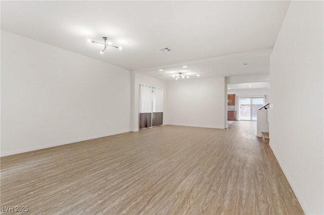 unfurnished room with light hardwood / wood-style floors