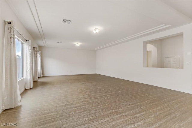 spare room featuring hardwood / wood-style floors