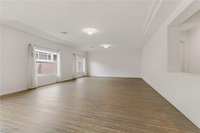 unfurnished room featuring wood-type flooring