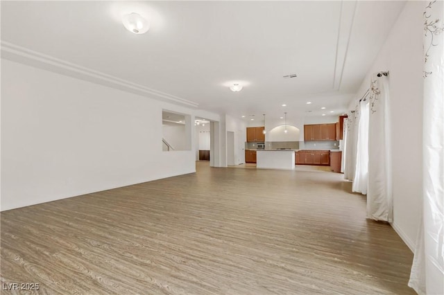 unfurnished living room with hardwood / wood-style floors