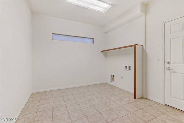 washroom featuring gas dryer hookup, washer hookup, light tile patterned flooring, and electric dryer hookup