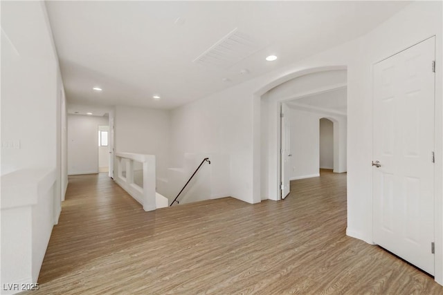 hall with light hardwood / wood-style floors