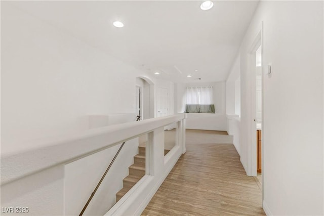 corridor with light wood-type flooring