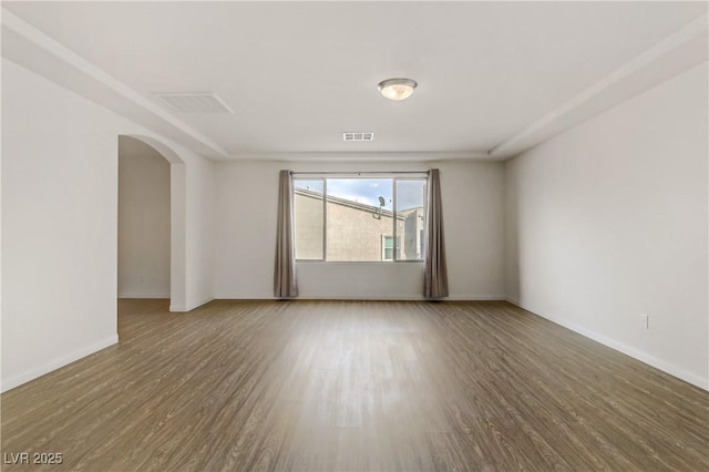 empty room with wood-type flooring