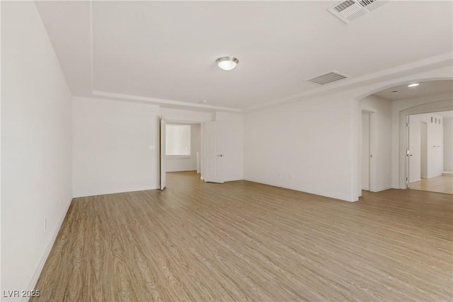 spare room featuring light hardwood / wood-style floors