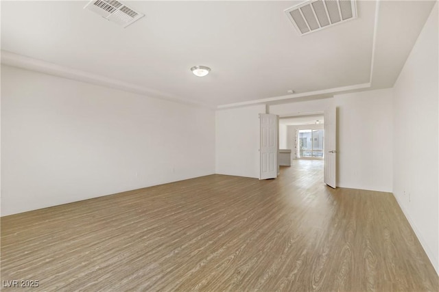 empty room with light hardwood / wood-style floors