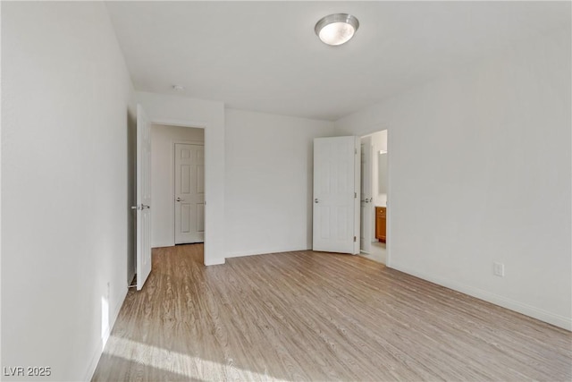 unfurnished room with light hardwood / wood-style flooring