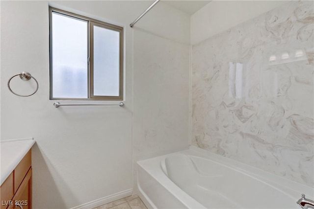 bathroom with vanity, tile patterned floors, and a tub