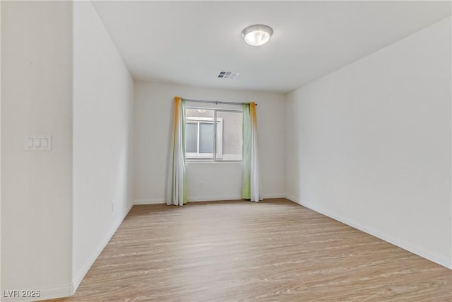 empty room featuring light hardwood / wood-style floors