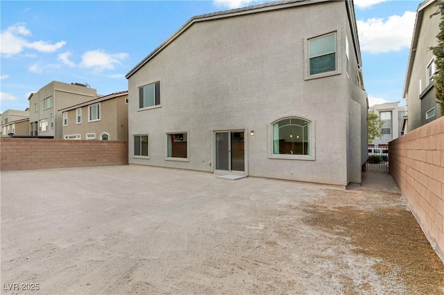 back of house featuring a patio