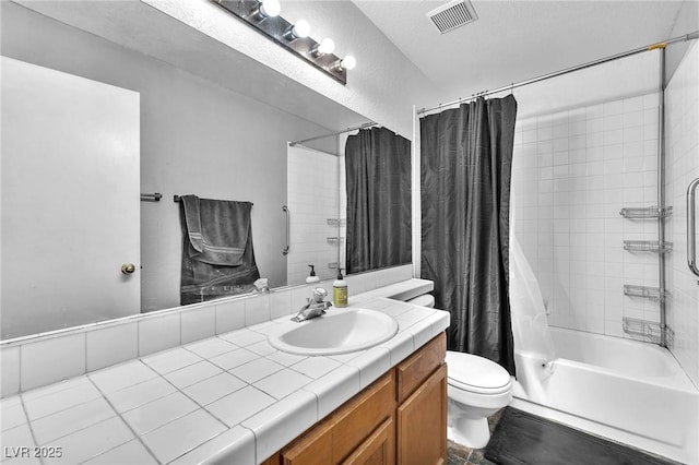 full bathroom with vanity, toilet, and shower / bath combo