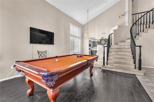 recreation room featuring billiards, dark hardwood / wood-style floors, and high vaulted ceiling