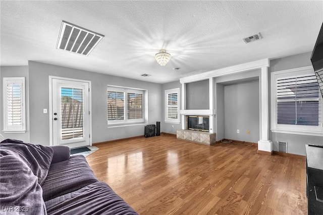 living room featuring hardwood / wood-style floors and a textured ceiling