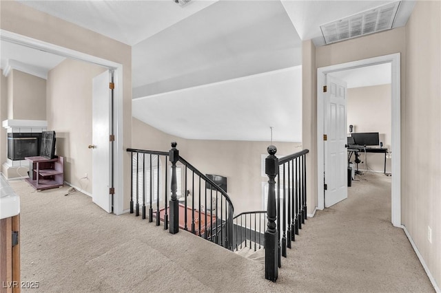 hall featuring light colored carpet