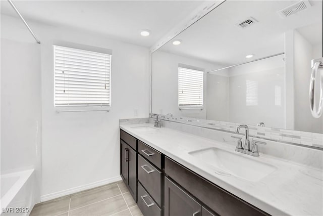 bathroom with tile patterned flooring, vanity, and shower / bathing tub combination