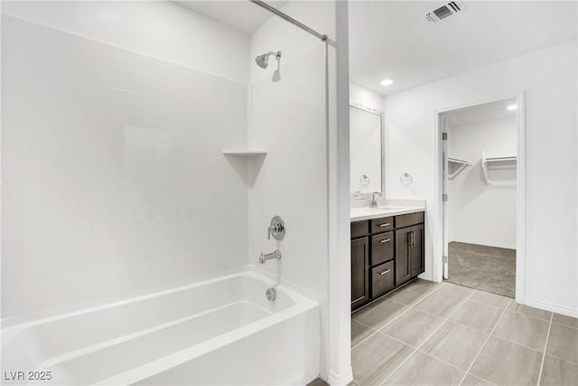 bathroom featuring vanity and bathing tub / shower combination