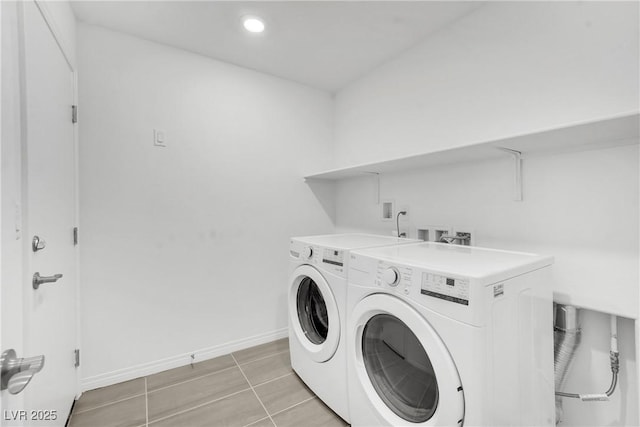 laundry area featuring light tile patterned flooring and independent washer and dryer