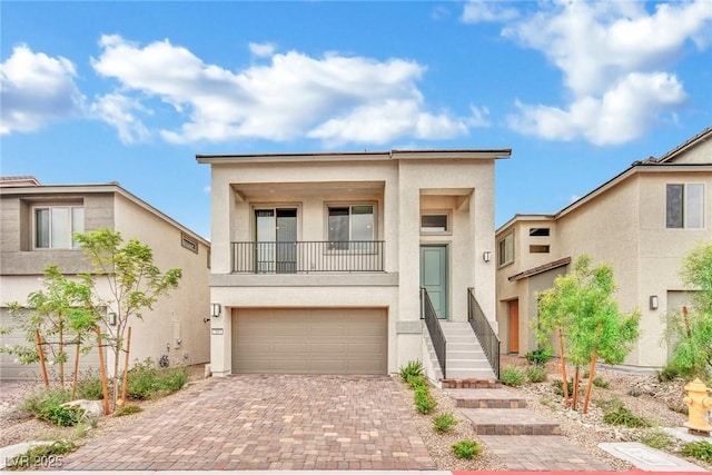 view of front of house with a balcony and a garage