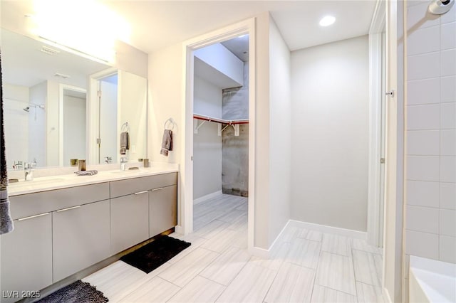 bathroom featuring vanity and a tile shower