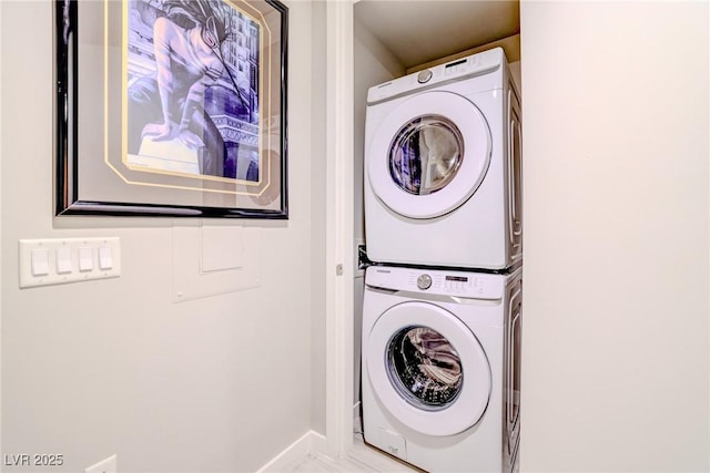 clothes washing area with stacked washer and clothes dryer