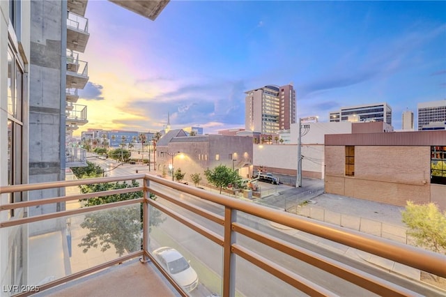 view of balcony at dusk