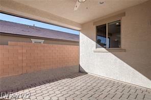 view of patio featuring ceiling fan