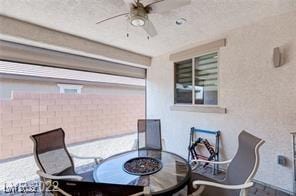 view of patio featuring ceiling fan