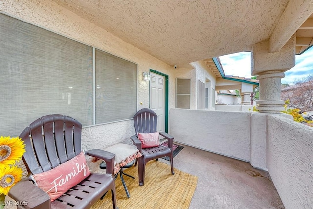 view of patio featuring a balcony