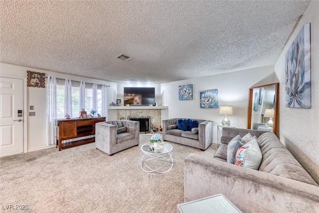 carpeted living room with a fireplace and a textured ceiling