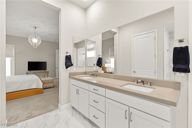 bathroom with vanity and a chandelier