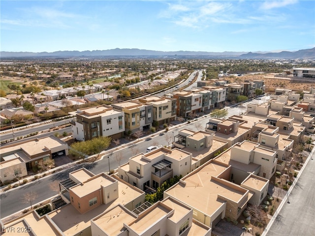 birds eye view of property featuring a mountain view