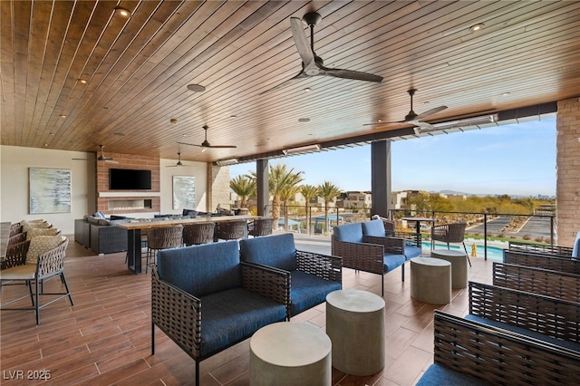 view of patio / terrace featuring ceiling fan and outdoor lounge area