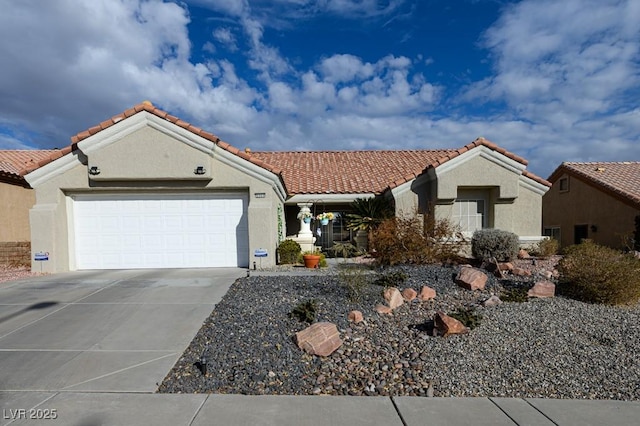 mediterranean / spanish house featuring a garage