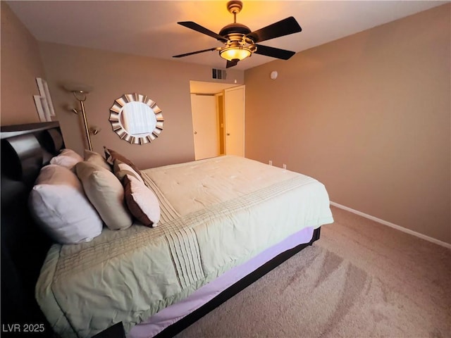 carpeted bedroom featuring visible vents, ceiling fan, and baseboards