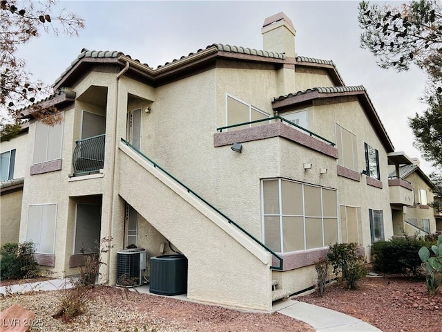 view of building exterior with central AC