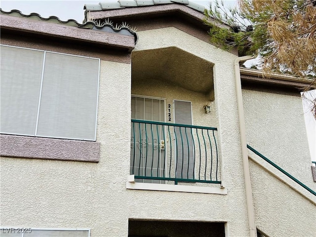 view of side of home featuring stucco siding