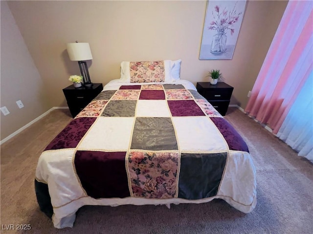 carpeted bedroom with baseboards