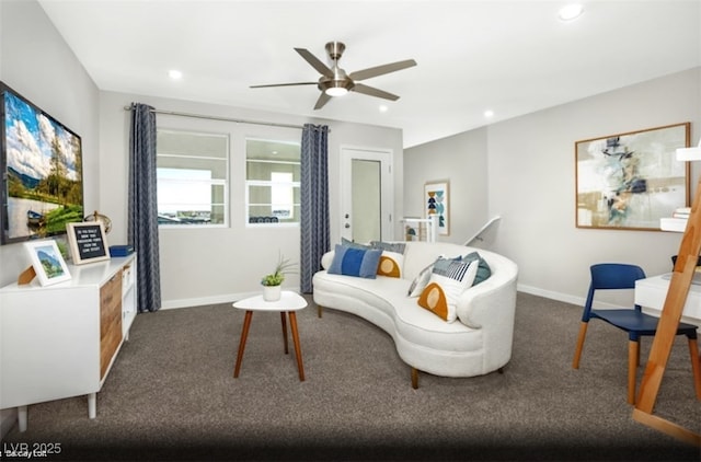 carpeted living room featuring ceiling fan