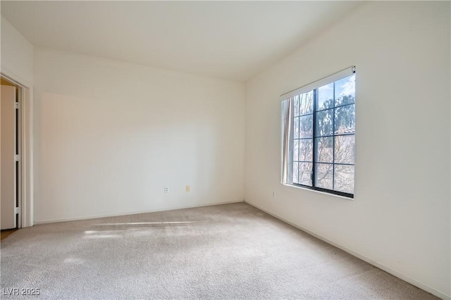 carpeted spare room with plenty of natural light