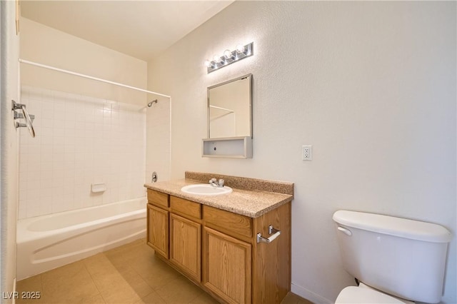 full bathroom featuring vanity, tile patterned flooring, tiled shower / bath combo, and toilet