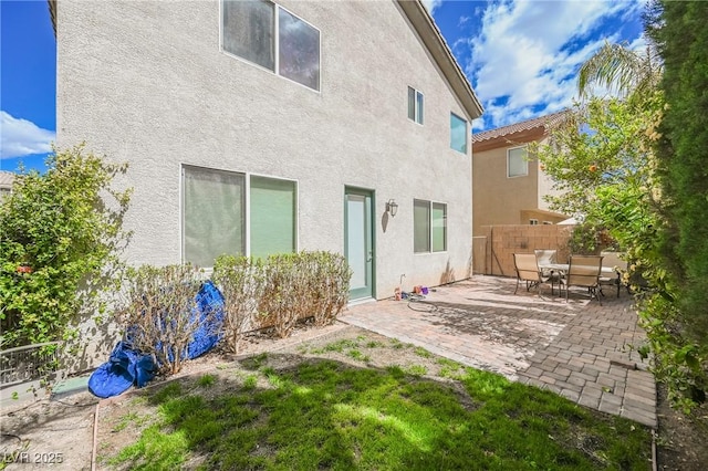 back of property with a patio area