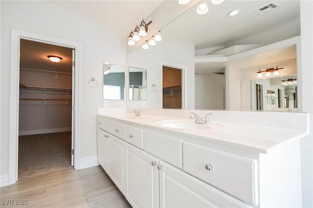 bathroom featuring vanity and hardwood / wood-style flooring